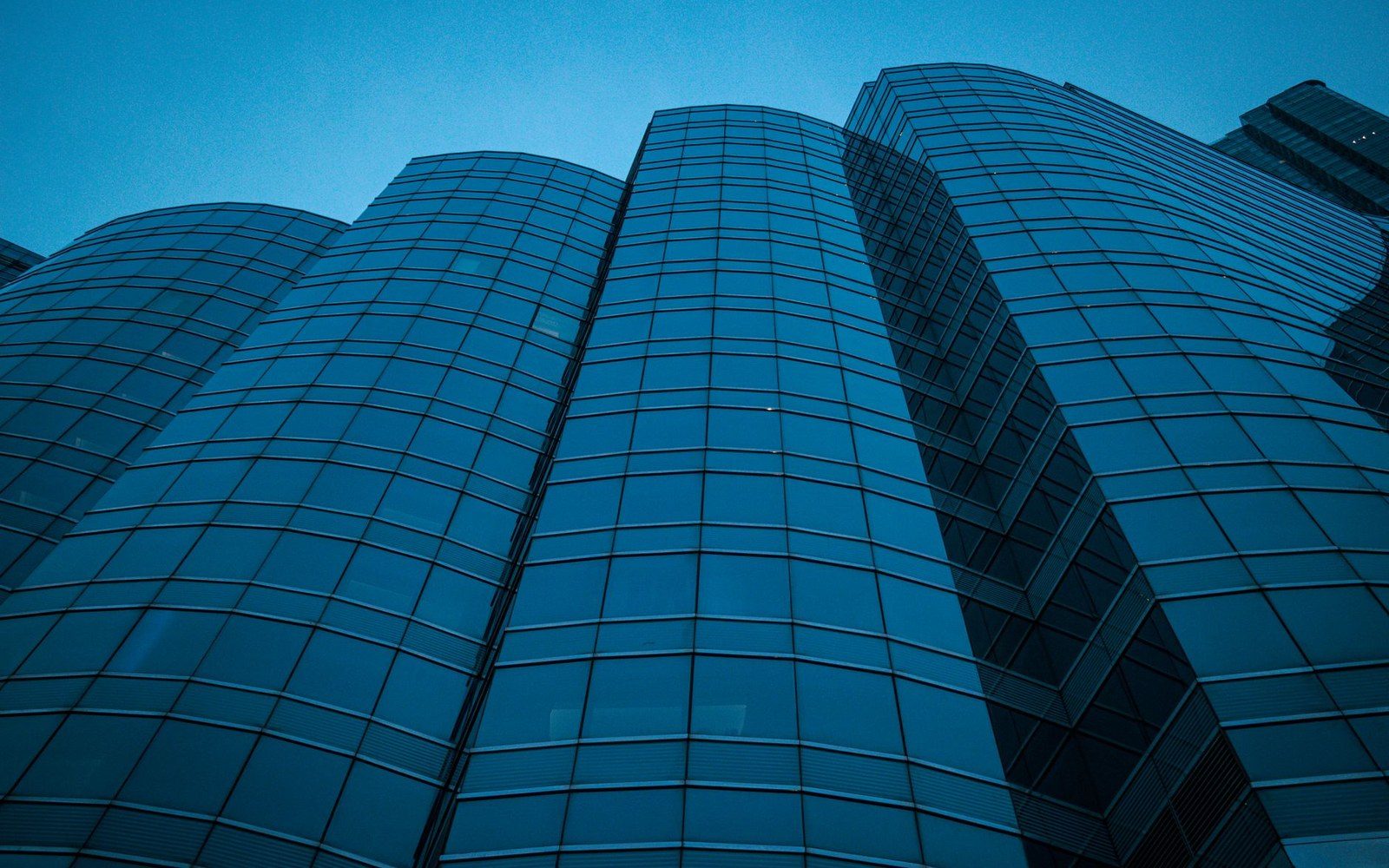 Glass office tower financial district dusk